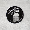 Winston-Salem: the city that's always happy to see you. This 3-inch weather-resistant vinyl sticker is perfect for your laptop, water bottle, car, or almost any other surface. Hand lettered by Em Dash Paper Co.
